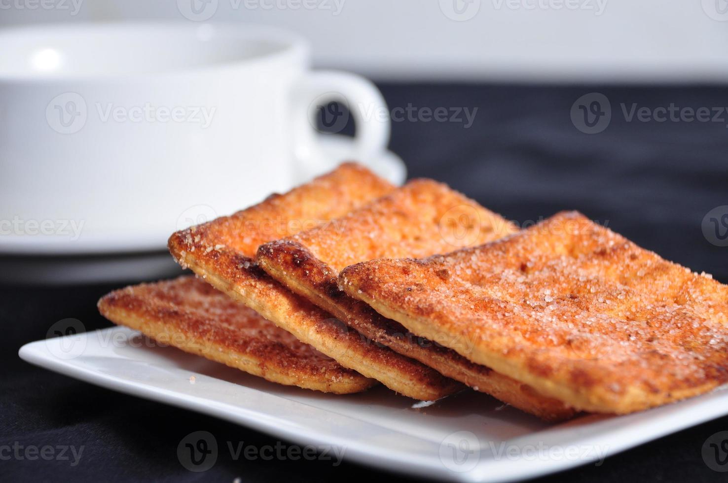 stack of cracker on the white plate photo