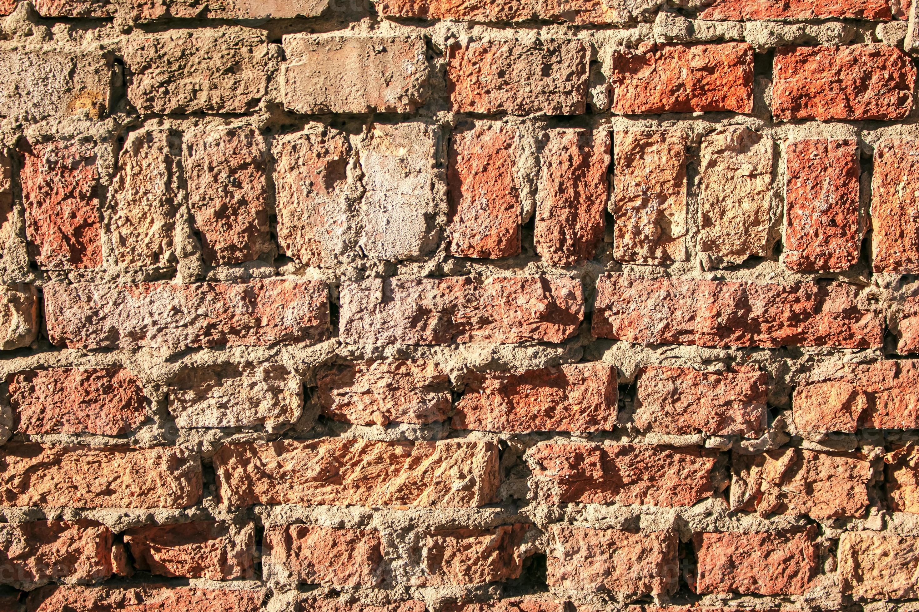 Old brick wall background, brick wall texture, structure. old broken brick,  cement joints, close-up. Construction, repair. Concept of devastation,  decline. 13185781 Stock Photo at Vecteezy