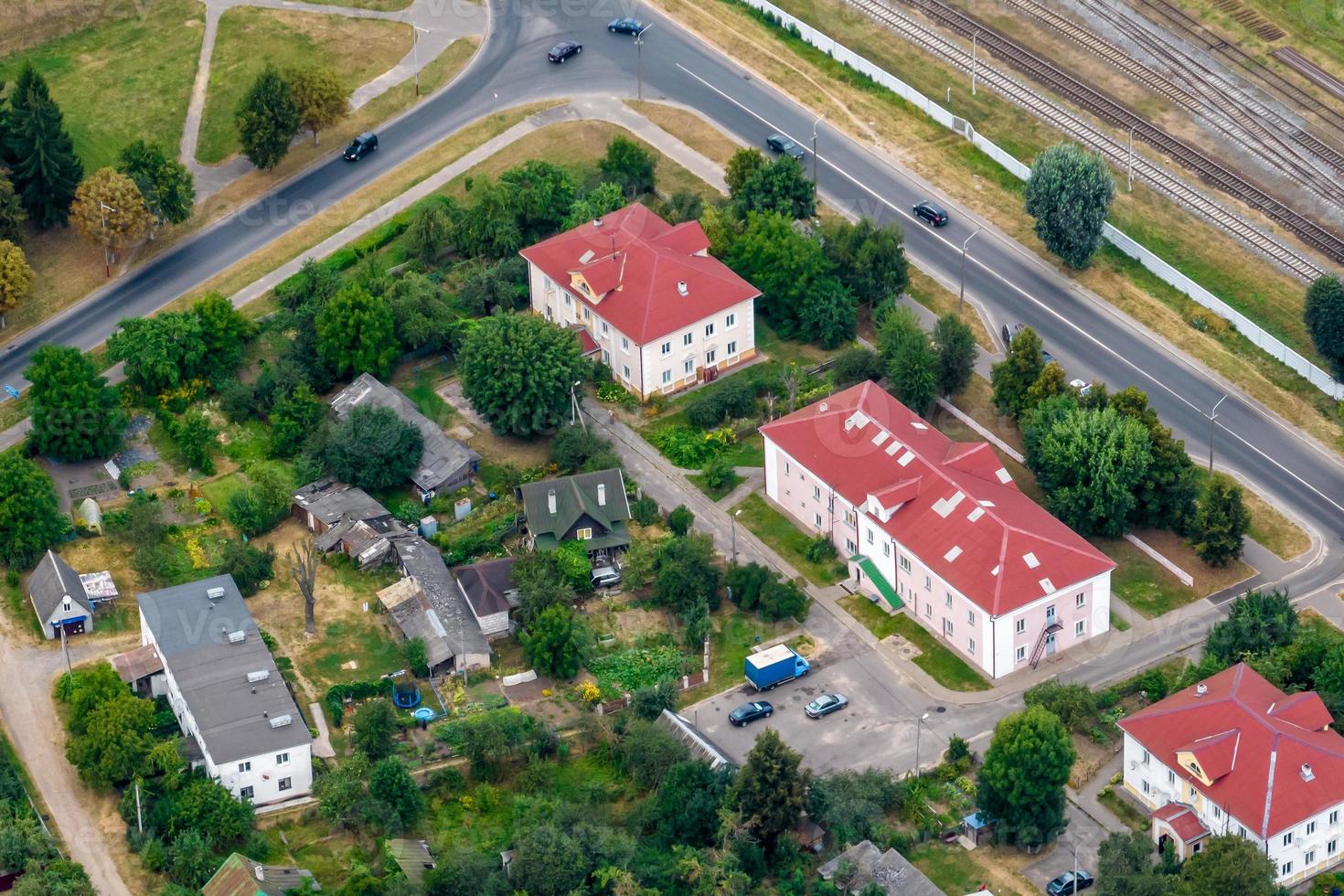 aerial panoramic view from a great height of a small provincial green town with a private sector and high-rise apartment buildings photo