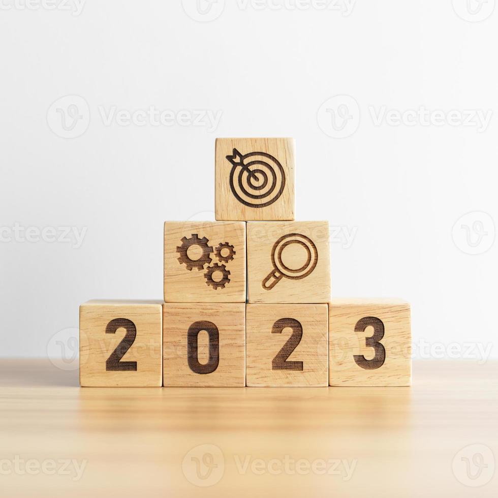 2023 wood block with business goal, plan. Action strategy, target, mission, teamwork, idea and New Year start concept photo