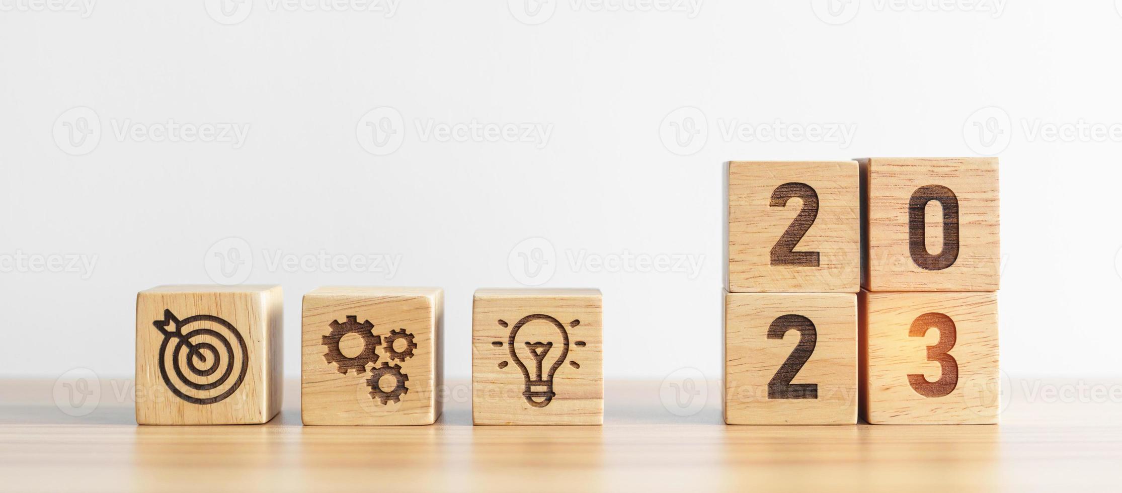 2023 wood block with business goal, plan. Action strategy, target, mission, teamwork, idea and New Year start concept photo