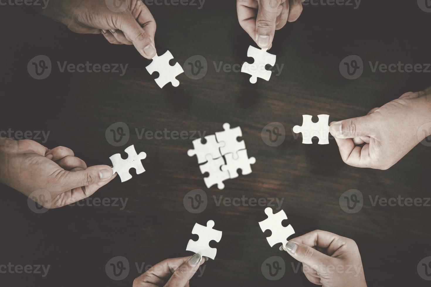 Business group connect pieces of puzzle think of problem solving. Brainstorm, decision concept. photo