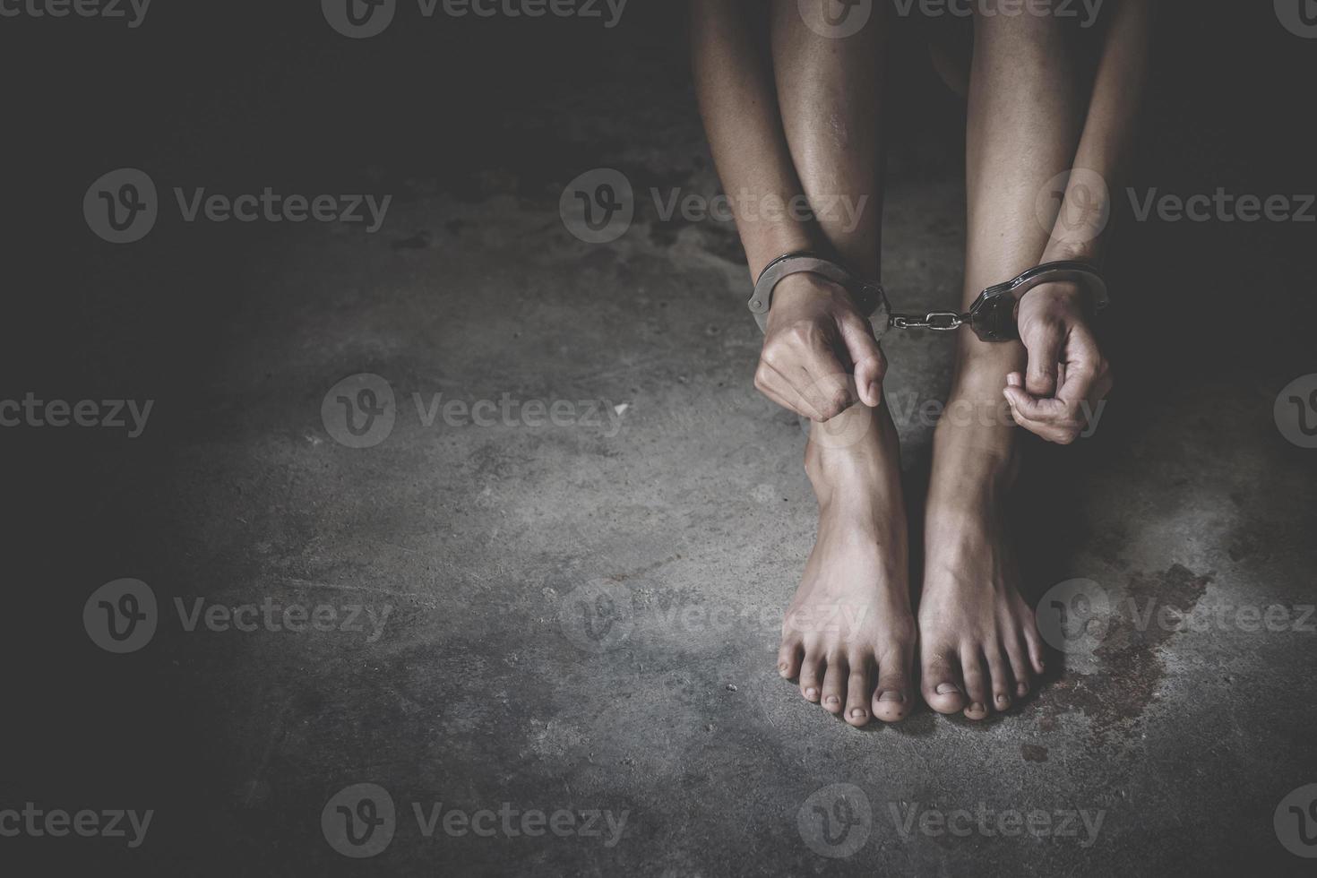 woman hands in handcuffs, human trafficking Concept, stop violence against women, Human rights violations. photo