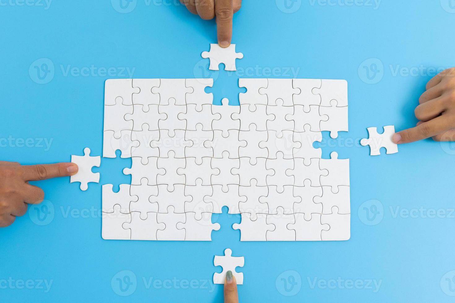 Jigsaw connection, Jigsaw puzzle in the hand of a businessman,  Business team assembling Jigsaw puzzle. photo