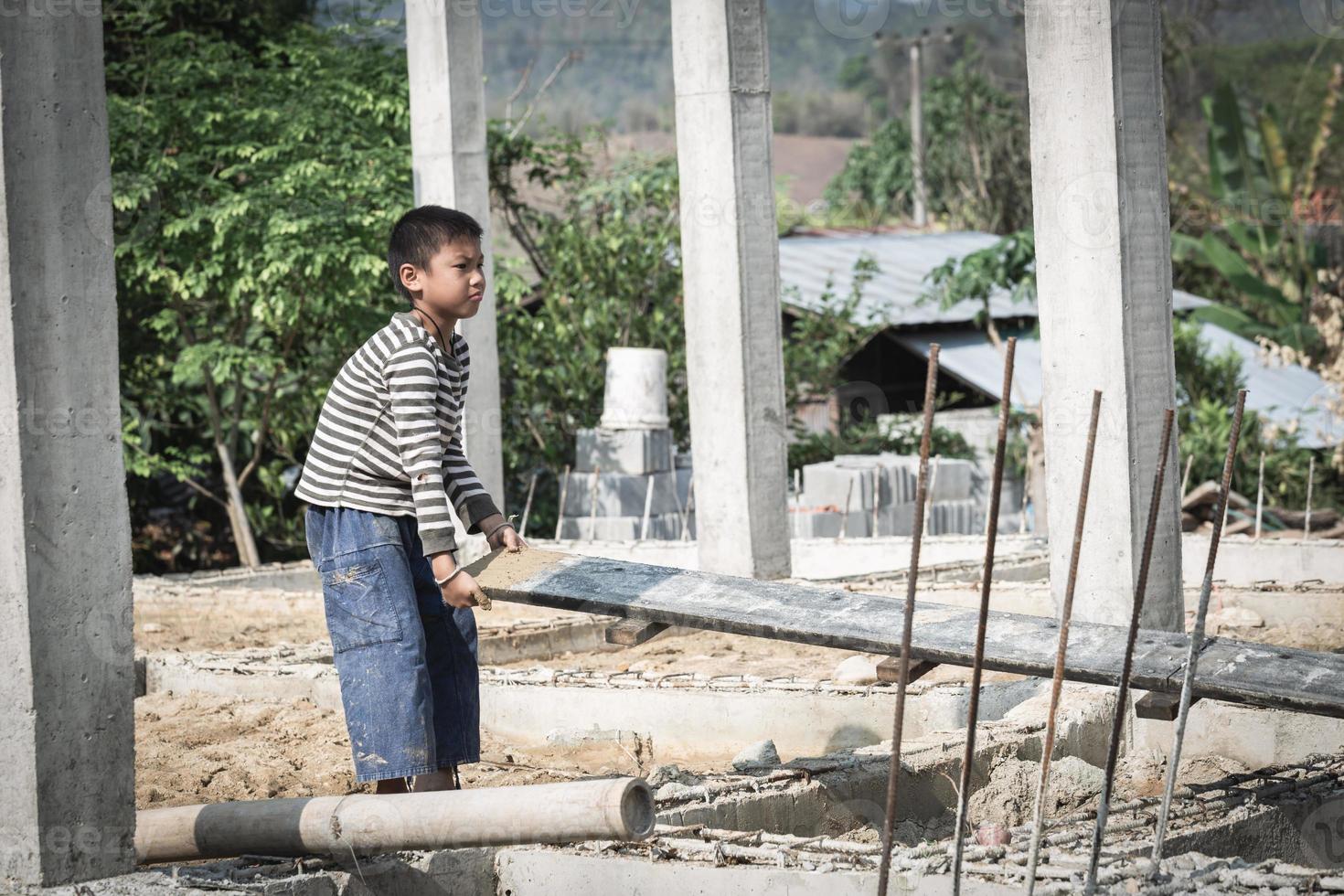 Children are forced to work construction., Violence children and trafficking concept,Anti-child labor, Rights Day on December 10. photo