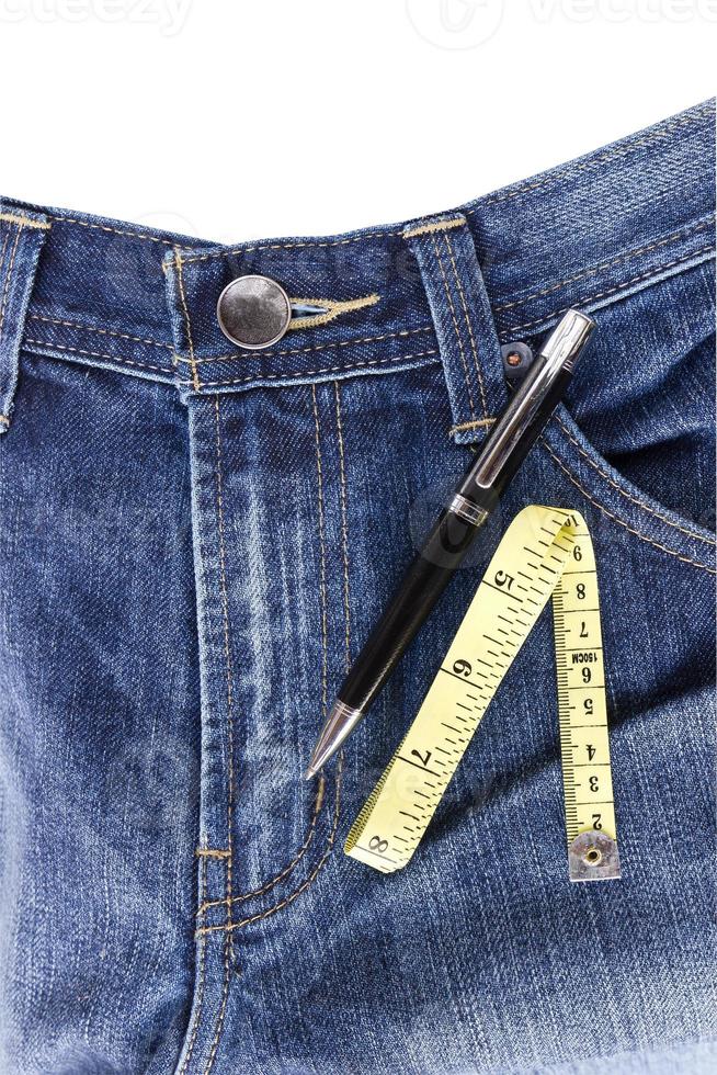 Closeup tailor hand use measuring tape to measure width of jeans