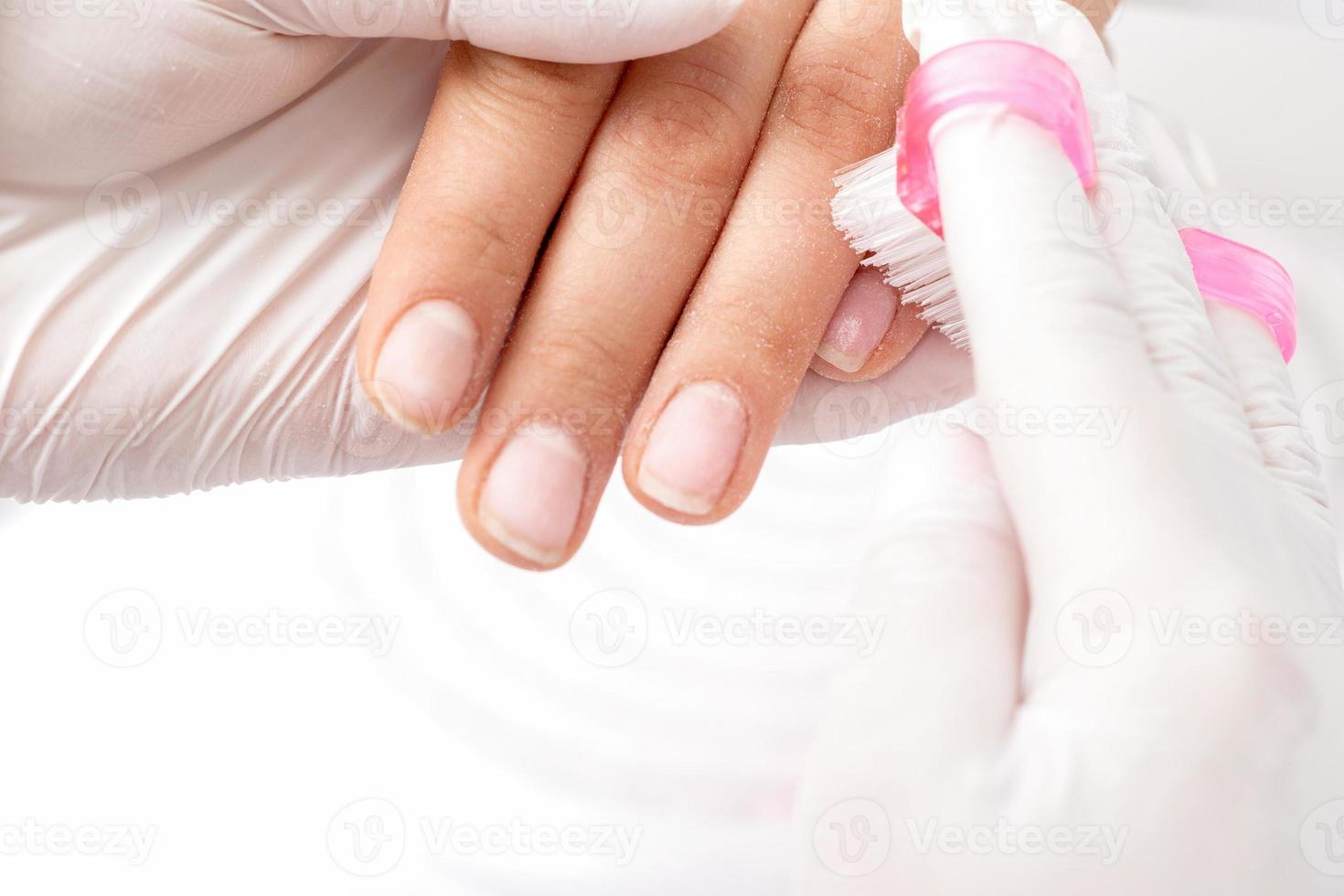 Manicure master removes dust. photo