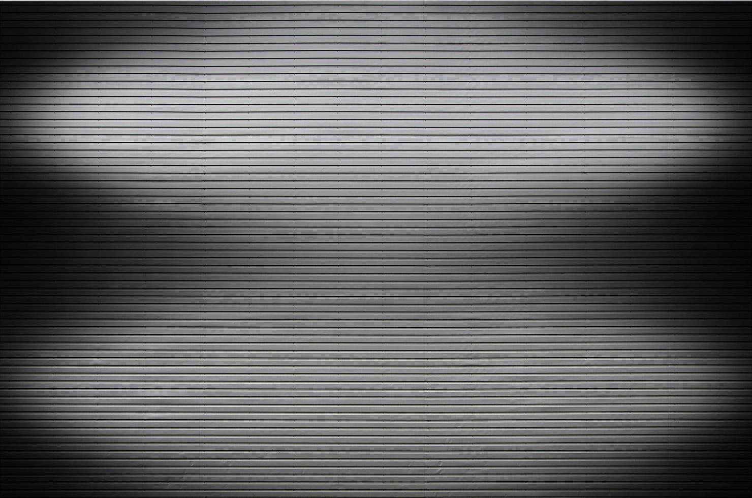 Metal wall with invisible light sources that illuminate the middle for product placement photo
