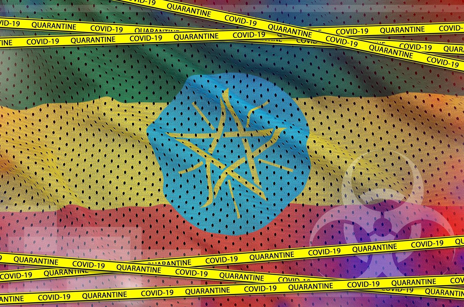 bandera de etiopía y cinta amarilla de cuarentena covid-19. coronavirus o concepto de virus 2019-ncov foto
