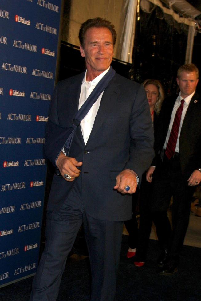 LOS ANGELES - FEB 13 - Arnold Schwarzenegger arrives at the Act of Valor LA Premiere at the ArcLight Theaters on February 13, 2012 in Los Angeles, CA photo