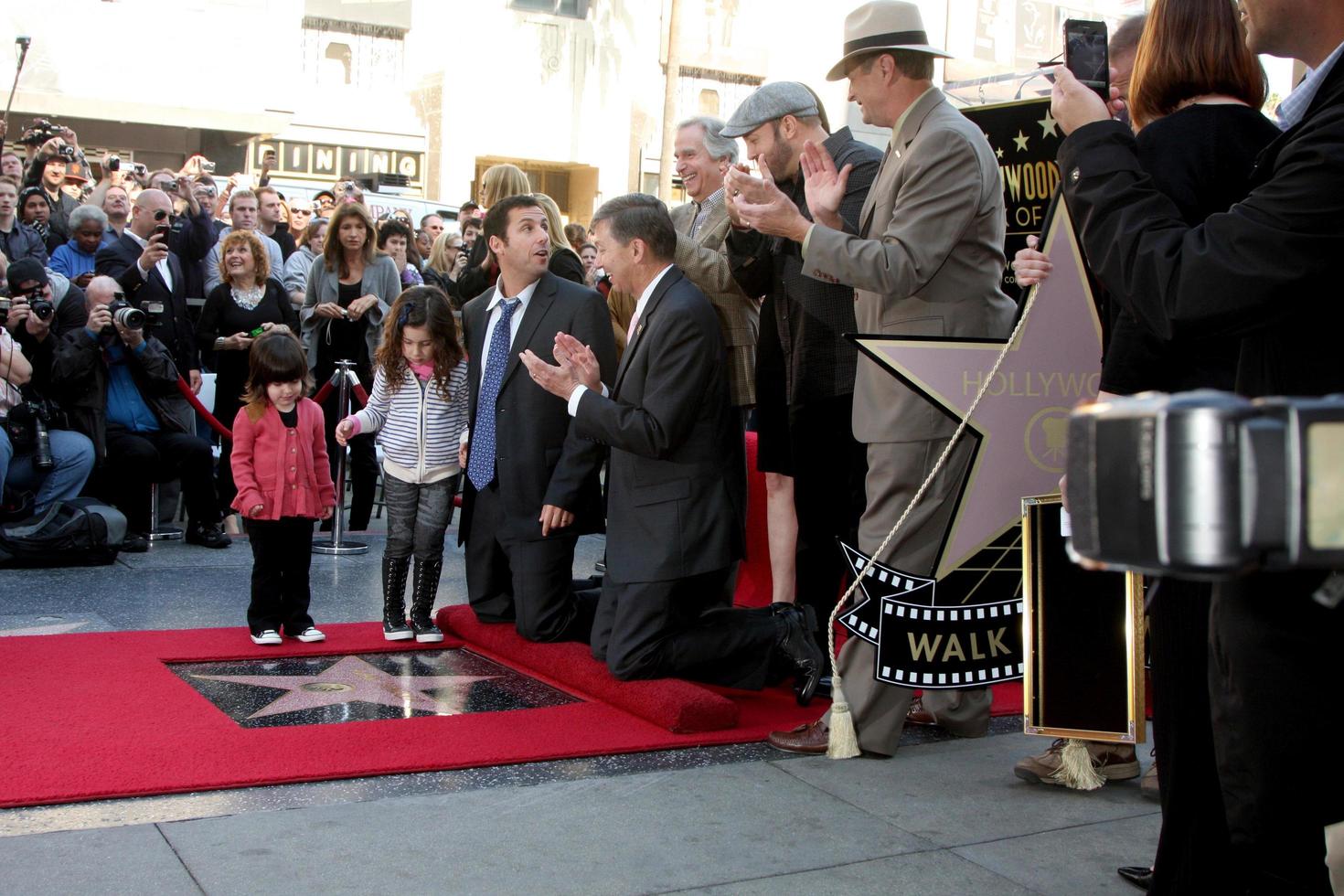 LOS ANGELES - FEB 1 - Adam Sandler, with daughters Sunny and Sadie at the Adam Sandler Hollywood Walk of Fame Star Ceremony at W Hotel on February 1, 2011 in Hollywood, CA photo