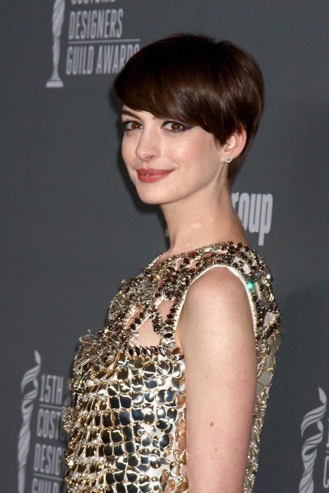 LOS ANGELES - FEB 19 - Anne Hathaway arrives at the 15th Annual Costume Designers Guild Awards at the Beverly HIlton Hotel on February 19, 2013 in Beverly Hills, CA photo