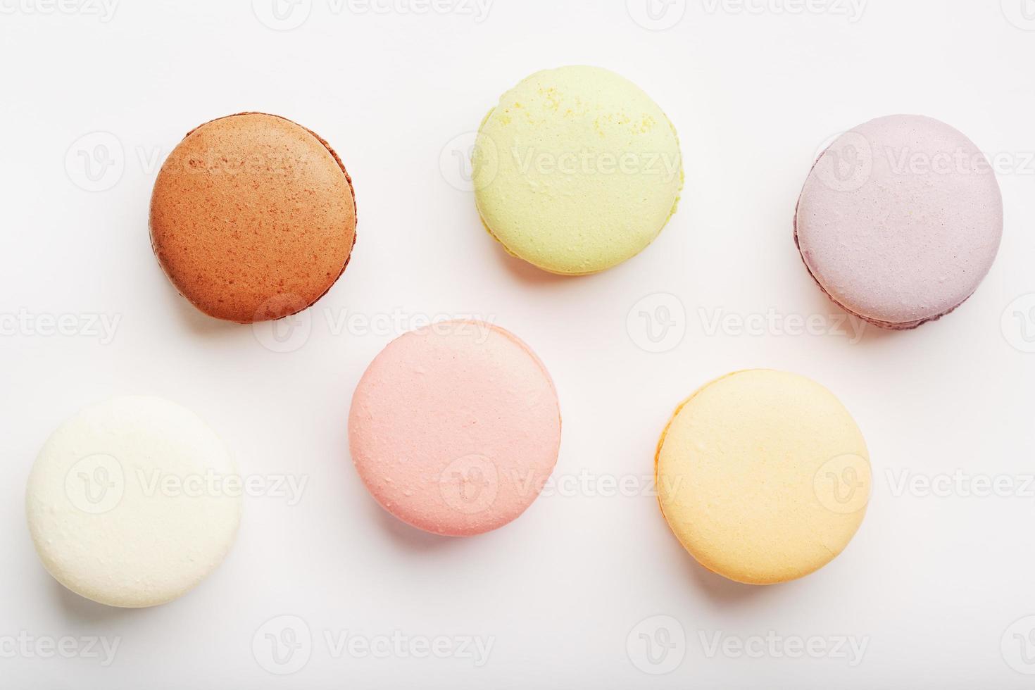 Macaroni cookies of different colors on a white background, isolate. photo