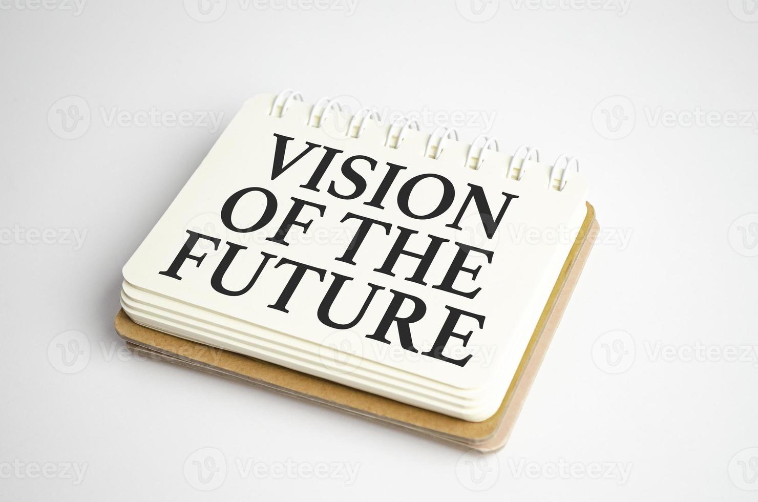 Team acronym and text Vision Of The Future on notepad and white background photo