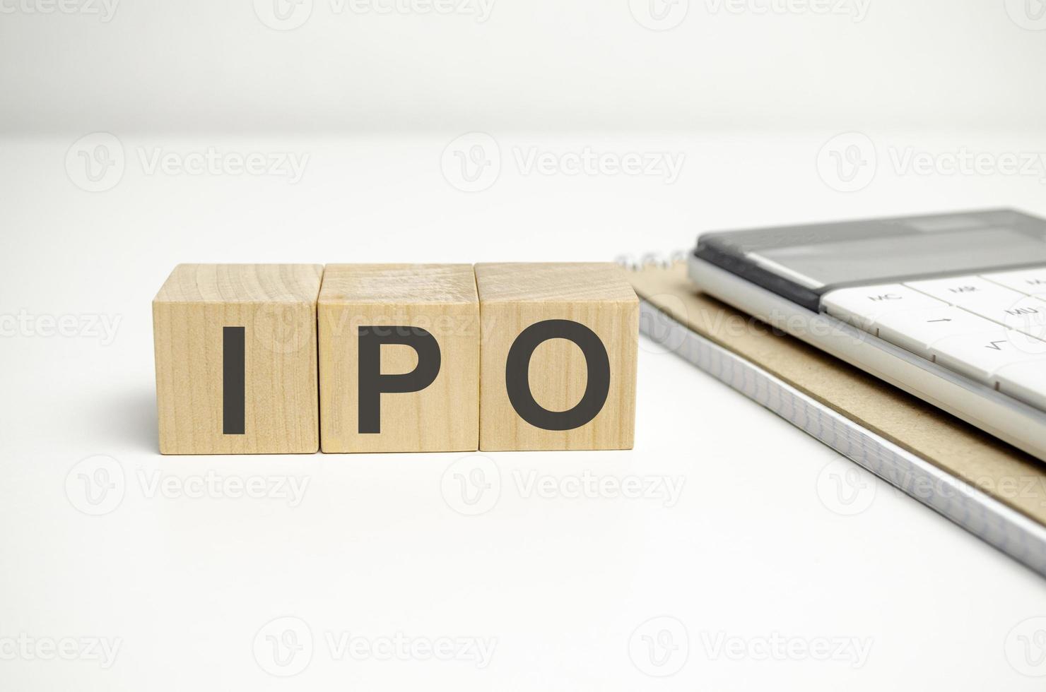 IPO word of wooden cube or block concept on wooden background. photo