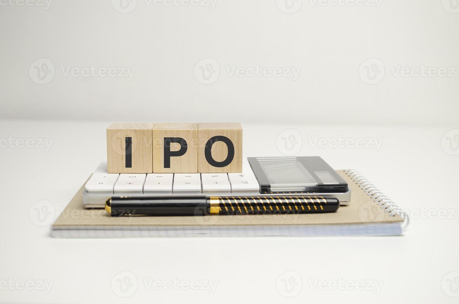 IPO word of wooden cube or block concept on wooden background. photo