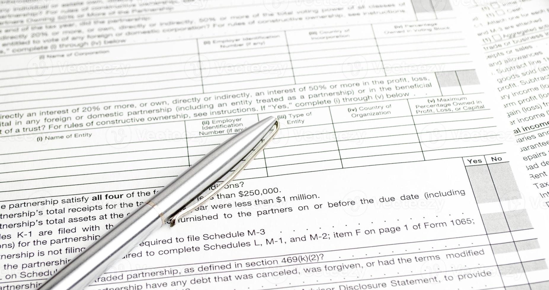 tax forms and pen with calculator. Tax concept photo