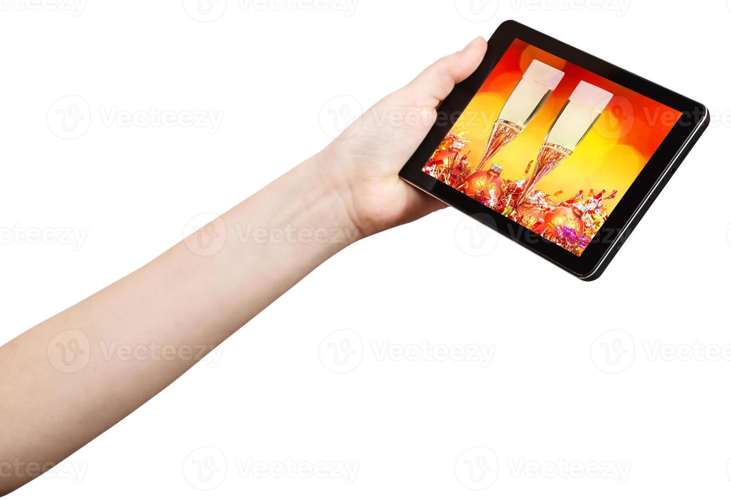 hand holds tablet-pc with Xmas still life photo