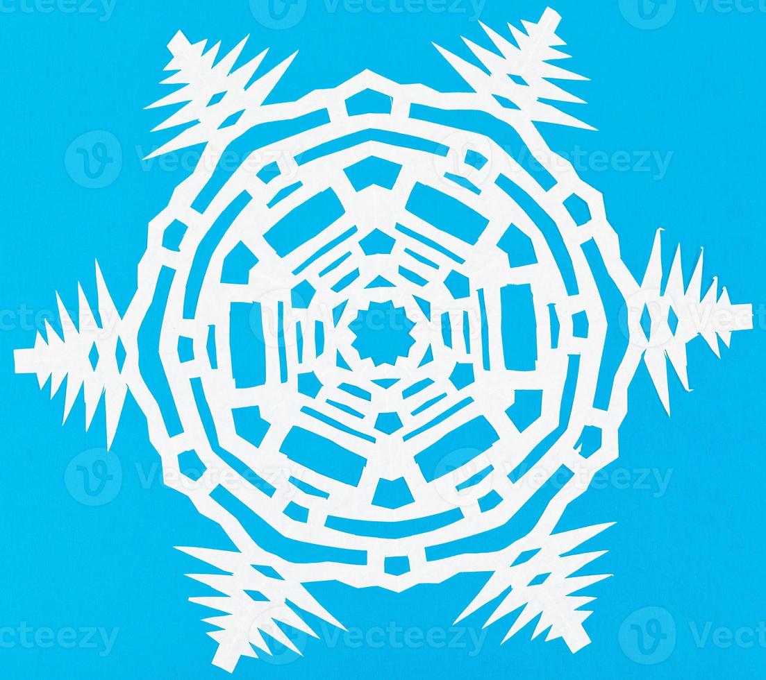 white snowflake on blue paper photo