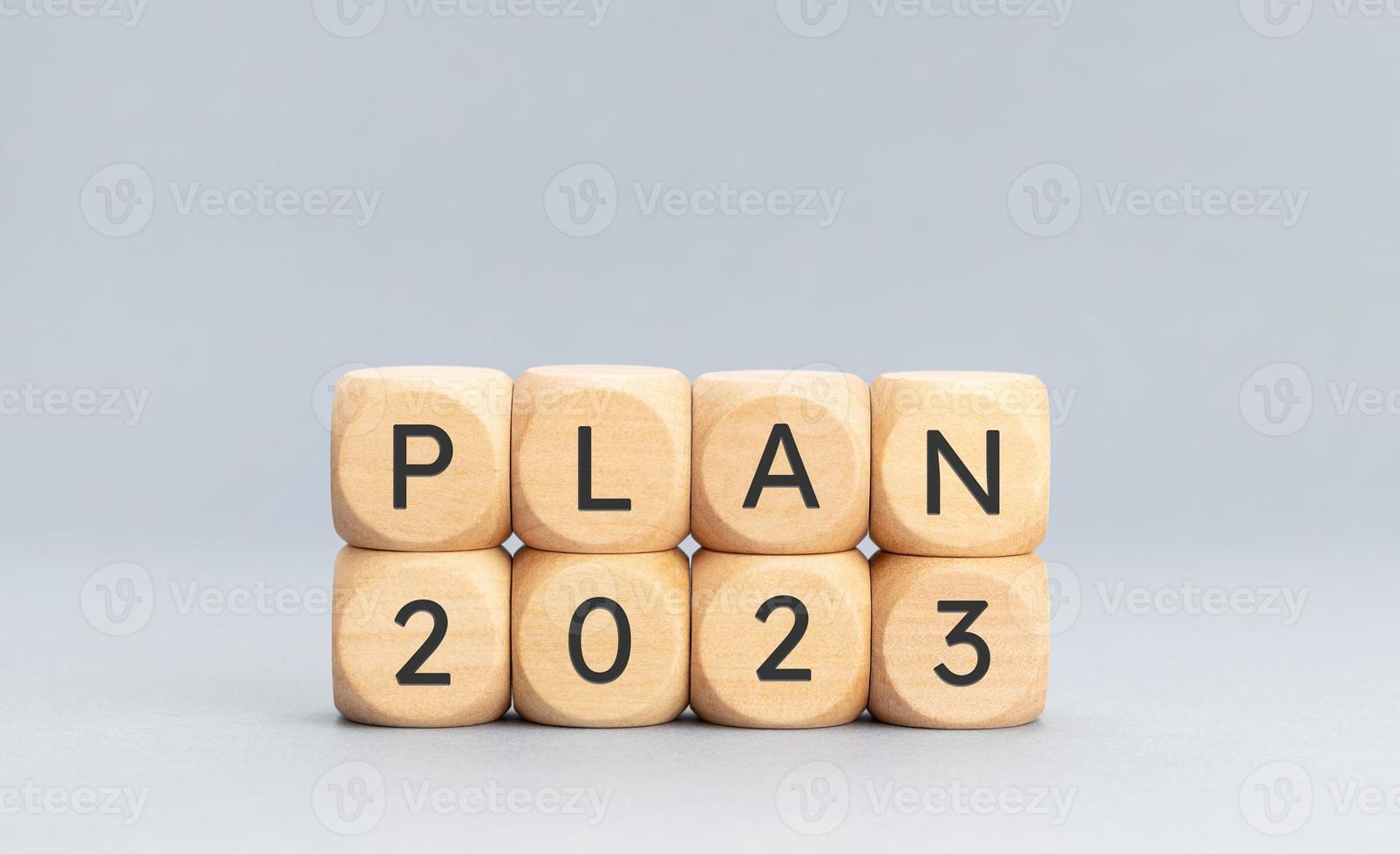 Plan 2023 message on wooden block shape on blue background. Copy space photo