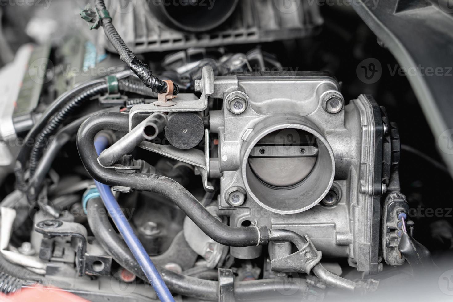 Close up old throttle Body of car in engine room with dust and Soot for repair and clean in process with engine room photo