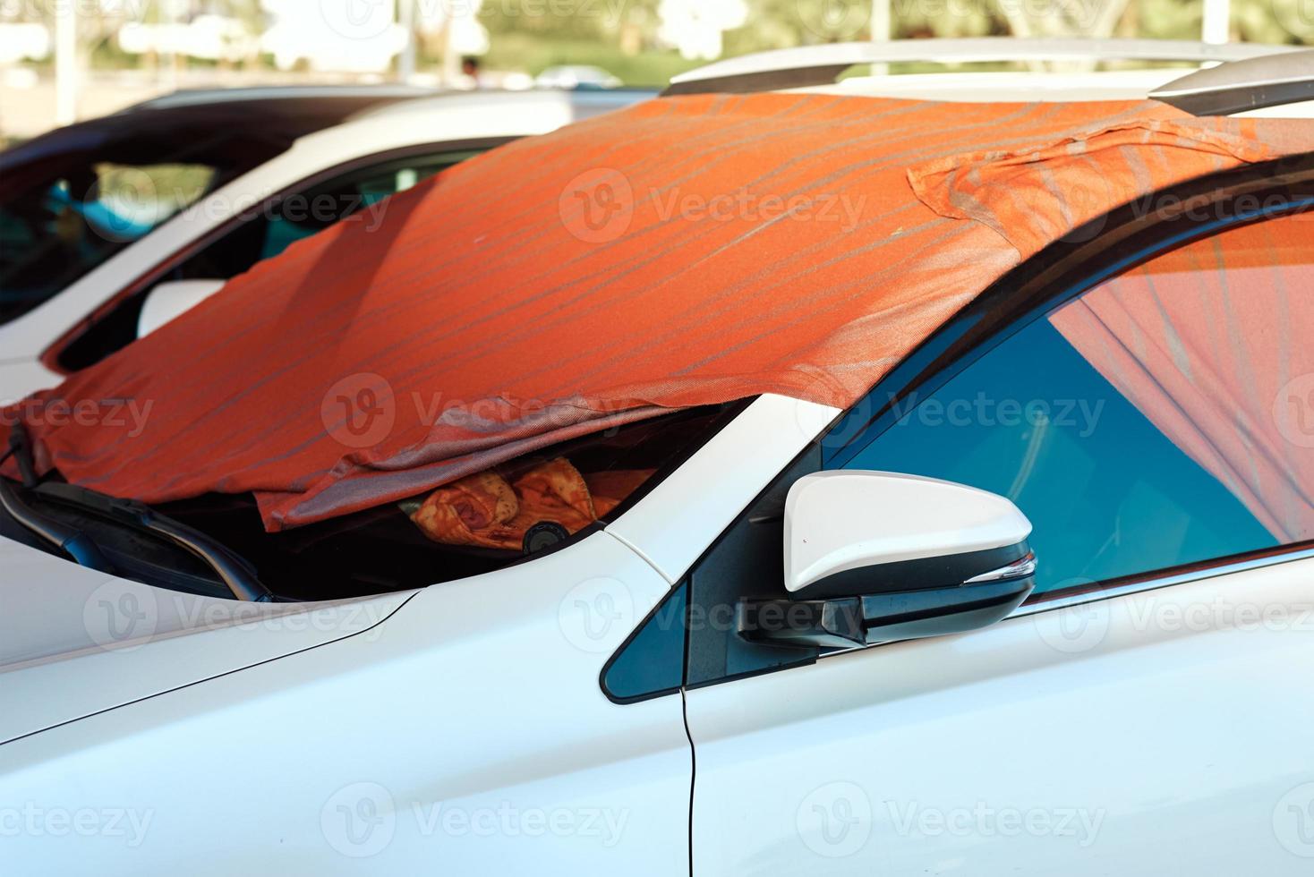 Sun shade made of blanket on car windshield 13226538 Stock Photo at
