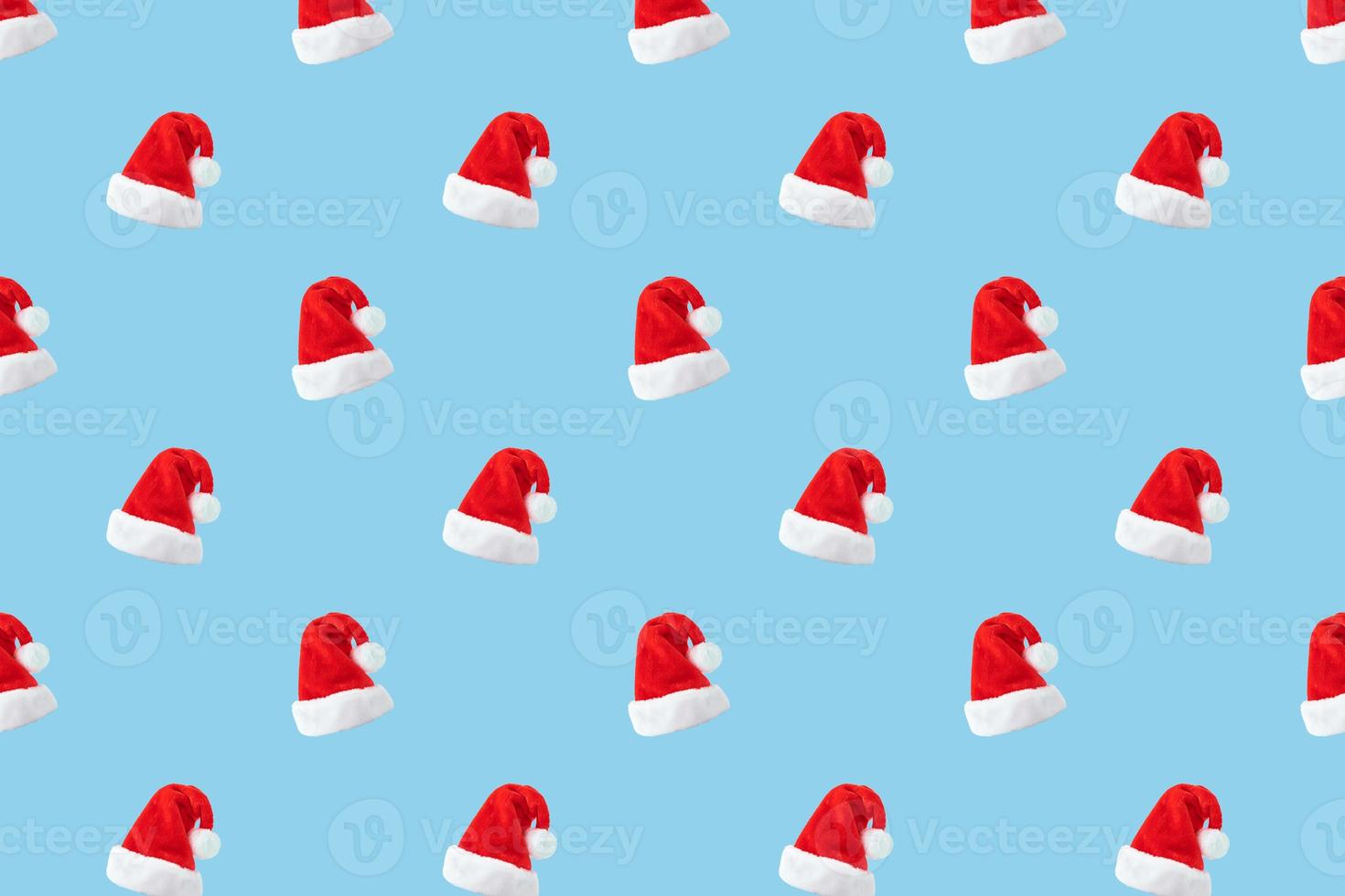 Santa Claus hat seamless pattern on blue background photo