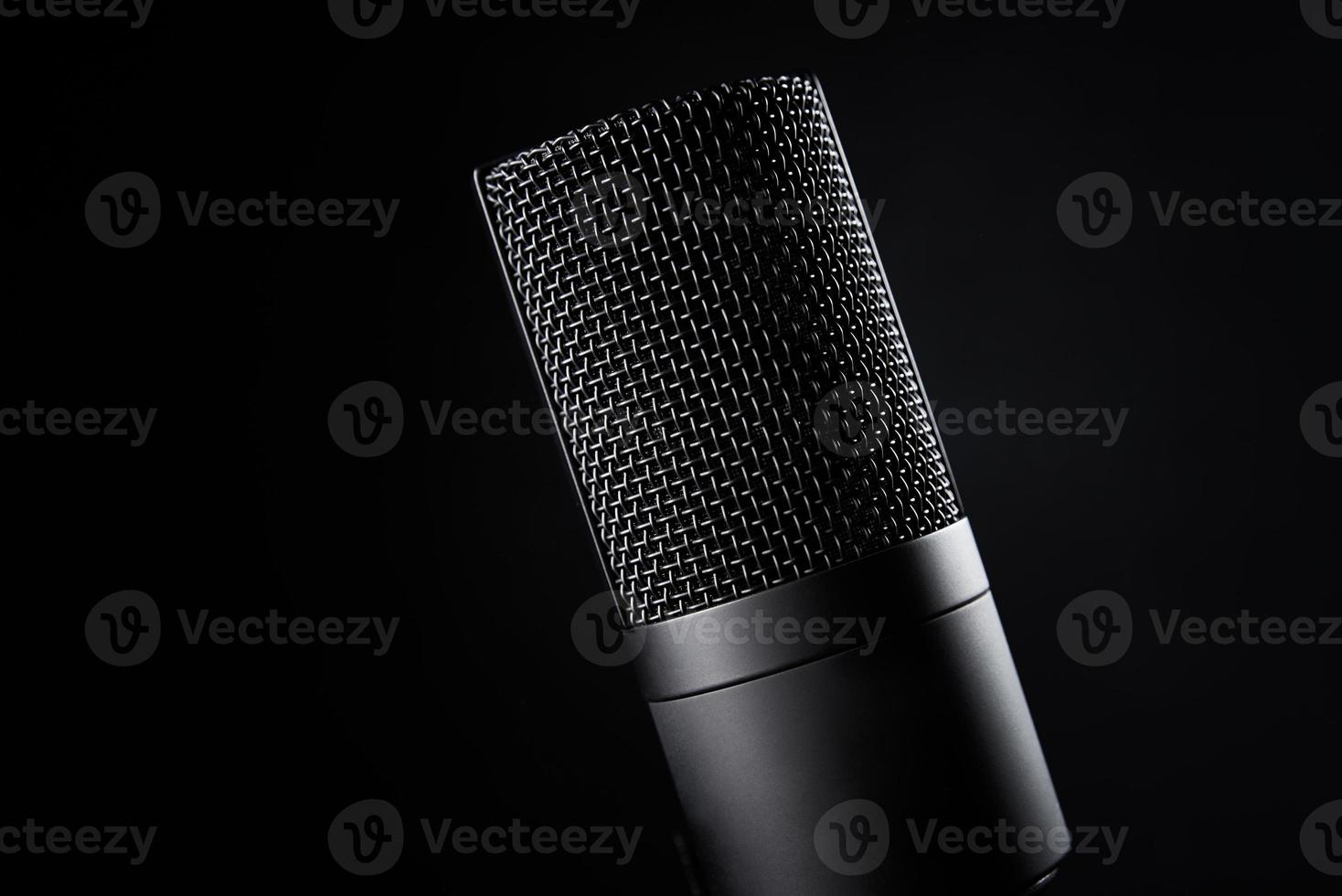 Studio microphone on dark background photo