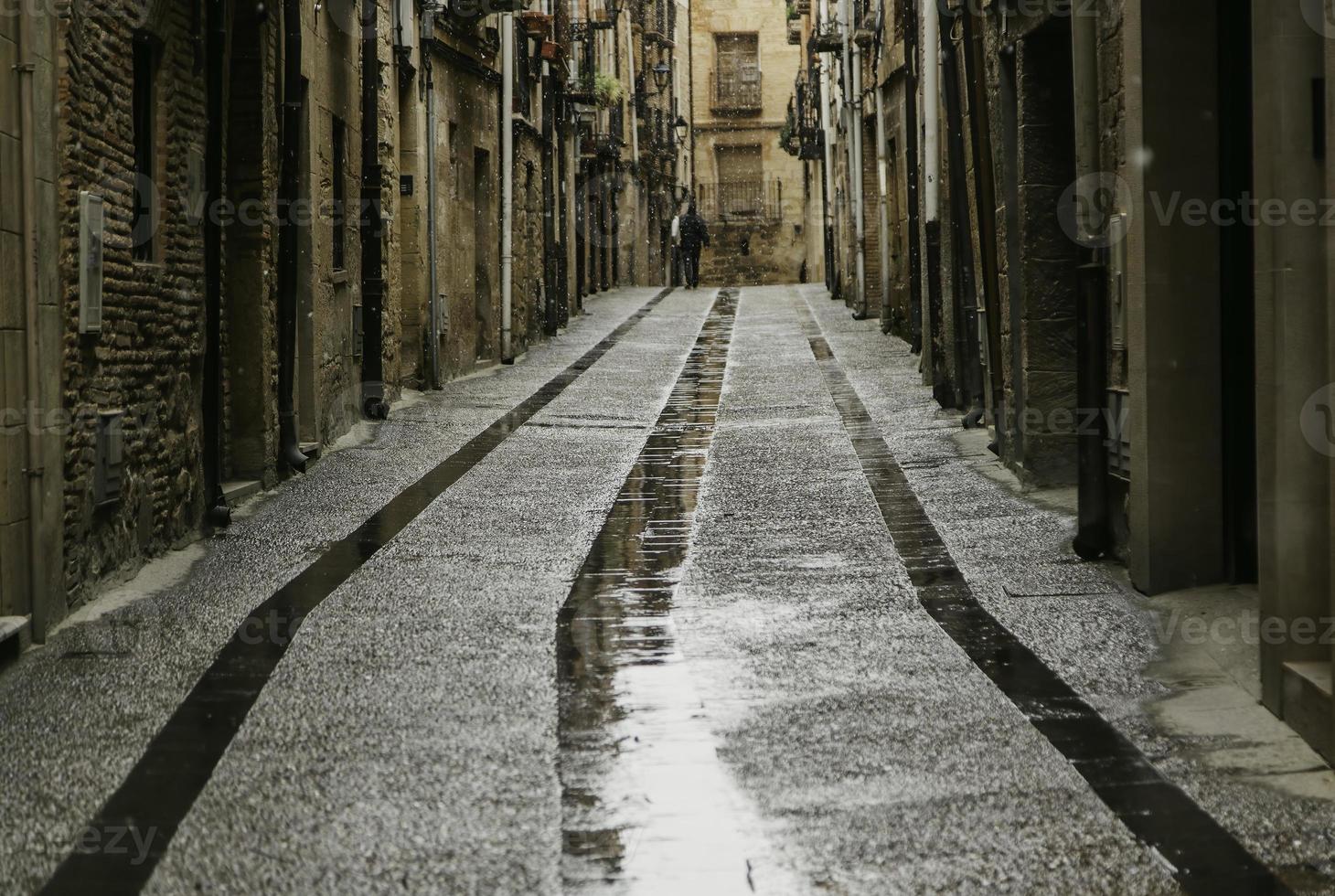 Walking with an umbrella in the snow photo