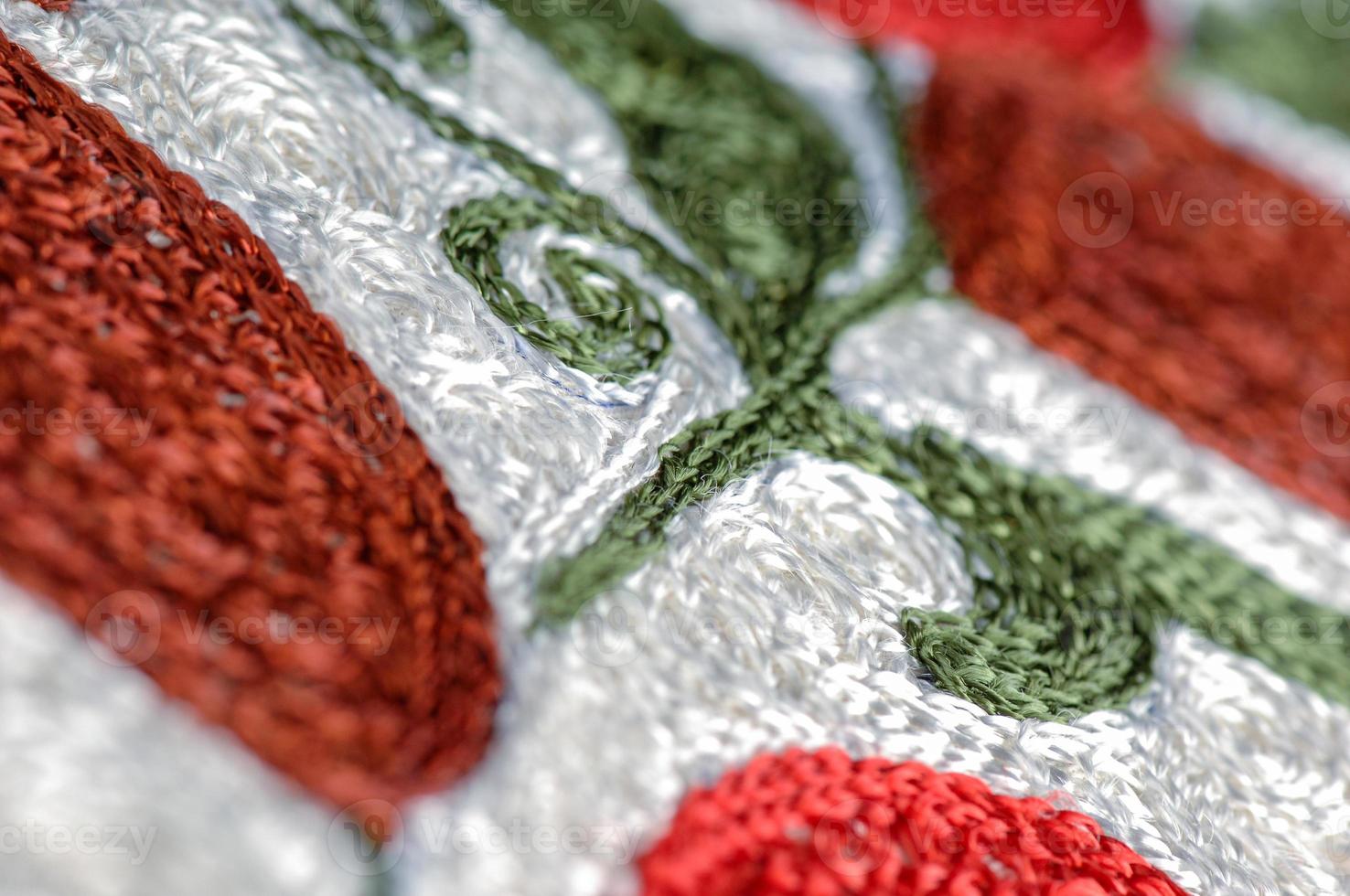 A closeup shot of national ornaments and patterns of Central Asia on a piece of cloth photo