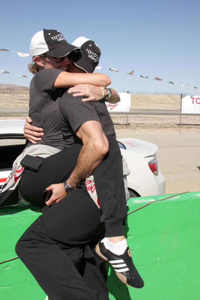 LOS ANGELES - MAR 15 - Tricia Helfer, Colin Egglesfield at the Toyota Grand Prix of Long Beach Pro-Celebrity Race Training at Willow Springs International Speedway on March 15, 2014 in Rosamond, CA photo