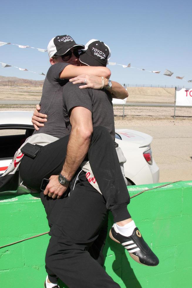 LOS ANGELES - MAR 15 - Tricia Helfer, Colin Egglesfield at the Toyota Grand Prix of Long Beach Pro-Celebrity Race Training at Willow Springs International Speedway on March 15, 2014 in Rosamond, CA photo