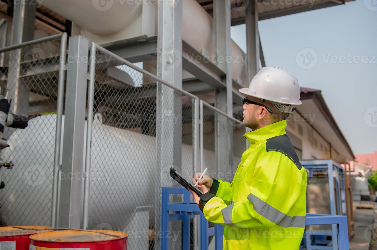Engineers work place to keep liquid helium,preventive maintenance schedule checking,Thailand people,Technicians and engineers discuss work together. photo