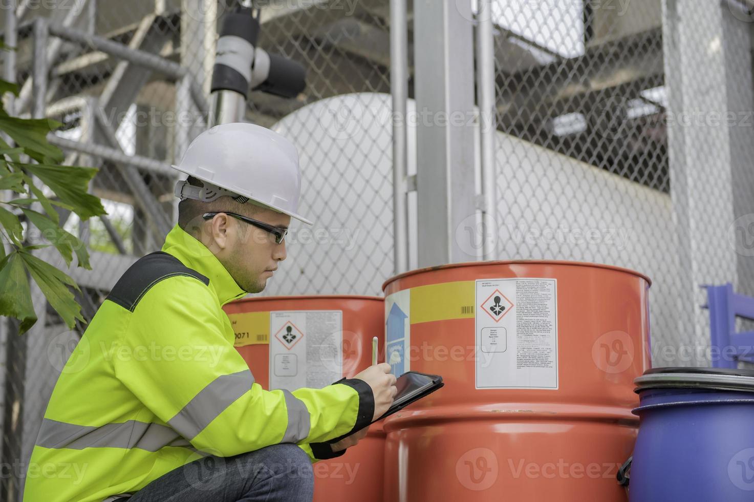 Engineers work place to keep liquid helium,preventive maintenance schedule checking,Thailand people,Technicians and engineers discuss work together. photo