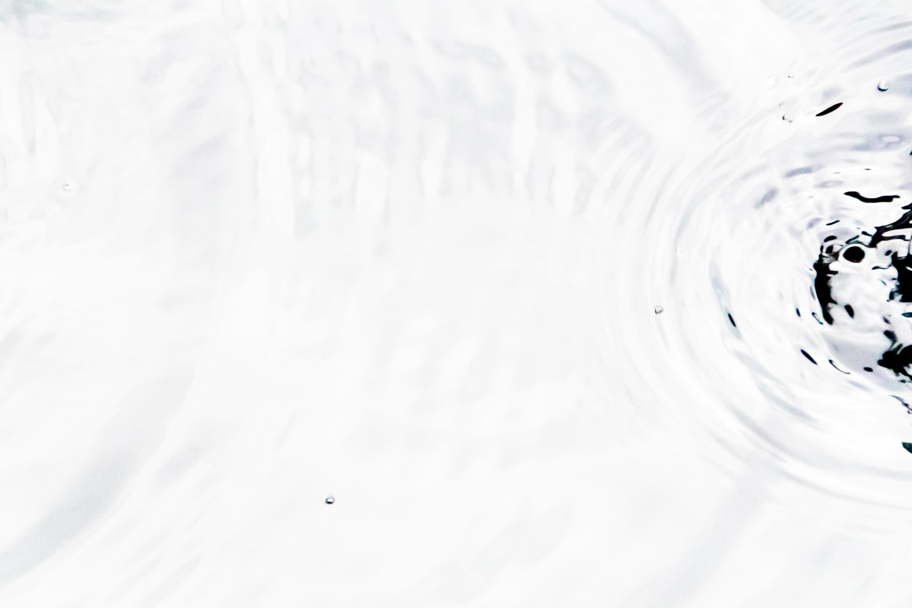 Water droplets or water beads fall on the water surface causing the