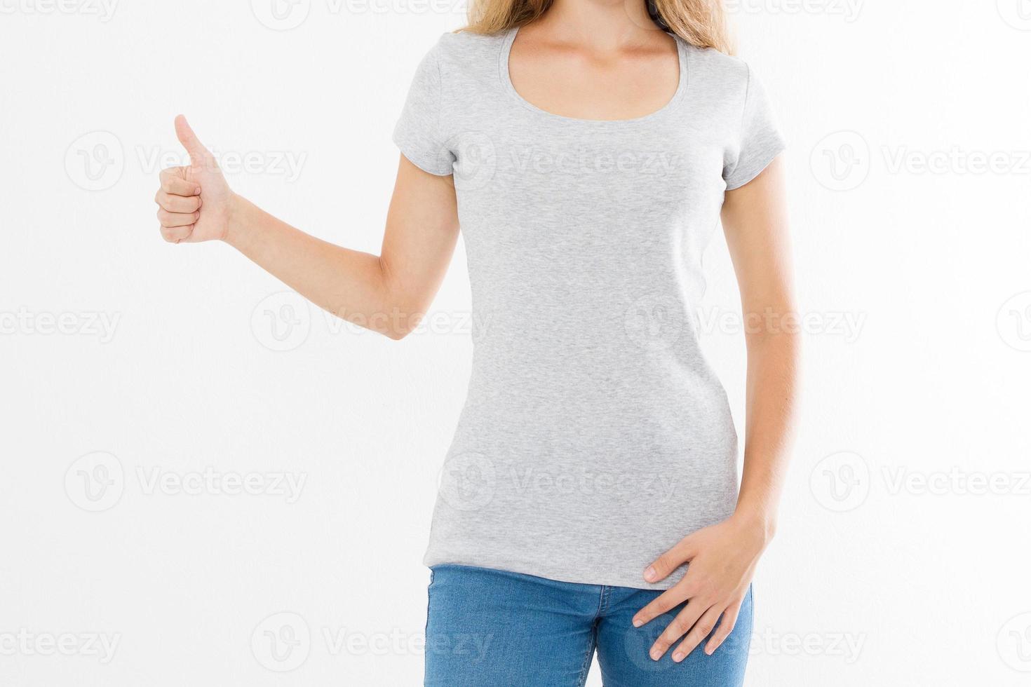 T shirt template. Girl showing big thumb up gesture sign isolated on white background. Body language. Copy space and mock up. Cropped image photo