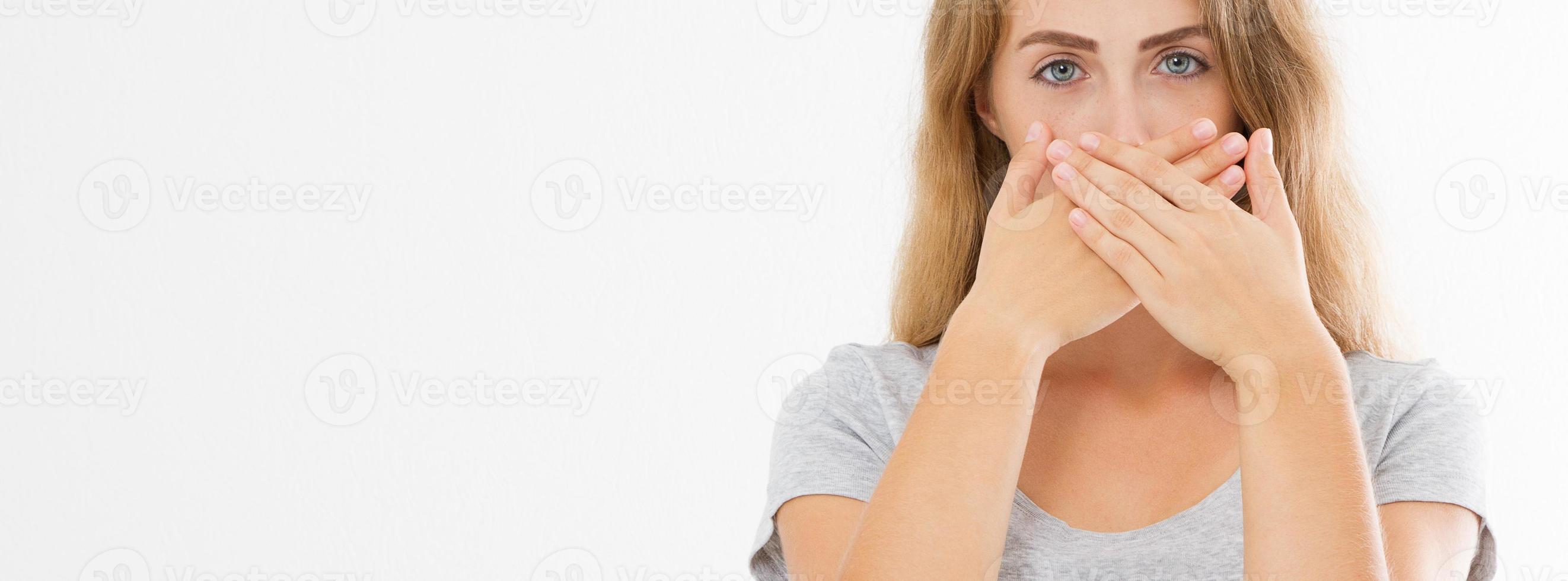 Banner image Shhh sign. Young woman showing shh gesture to keep a silent. Girl in t shirt keep a secret. Quiet place and silence time. Copy space photo