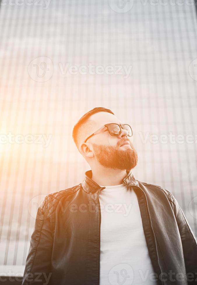 hipster man in leather jacket photo