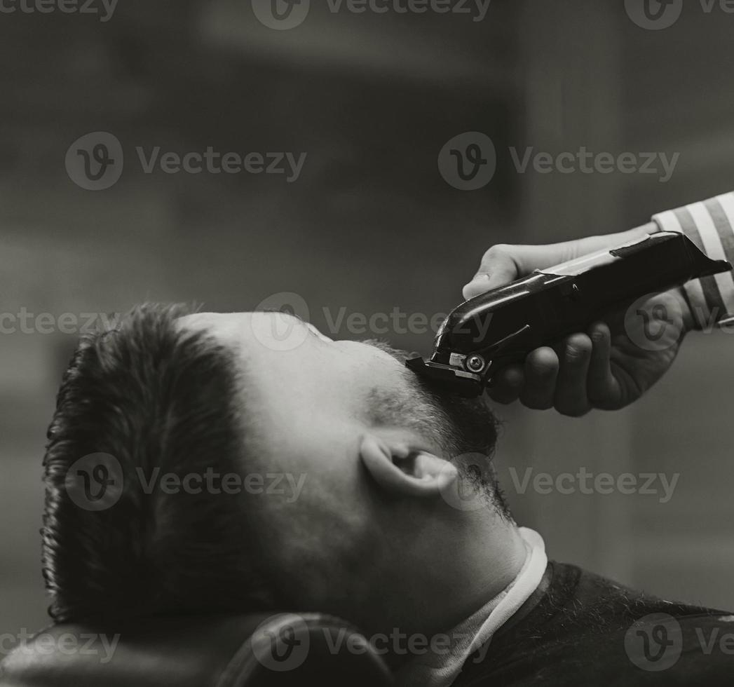 Hipster guy sitting at salon photo