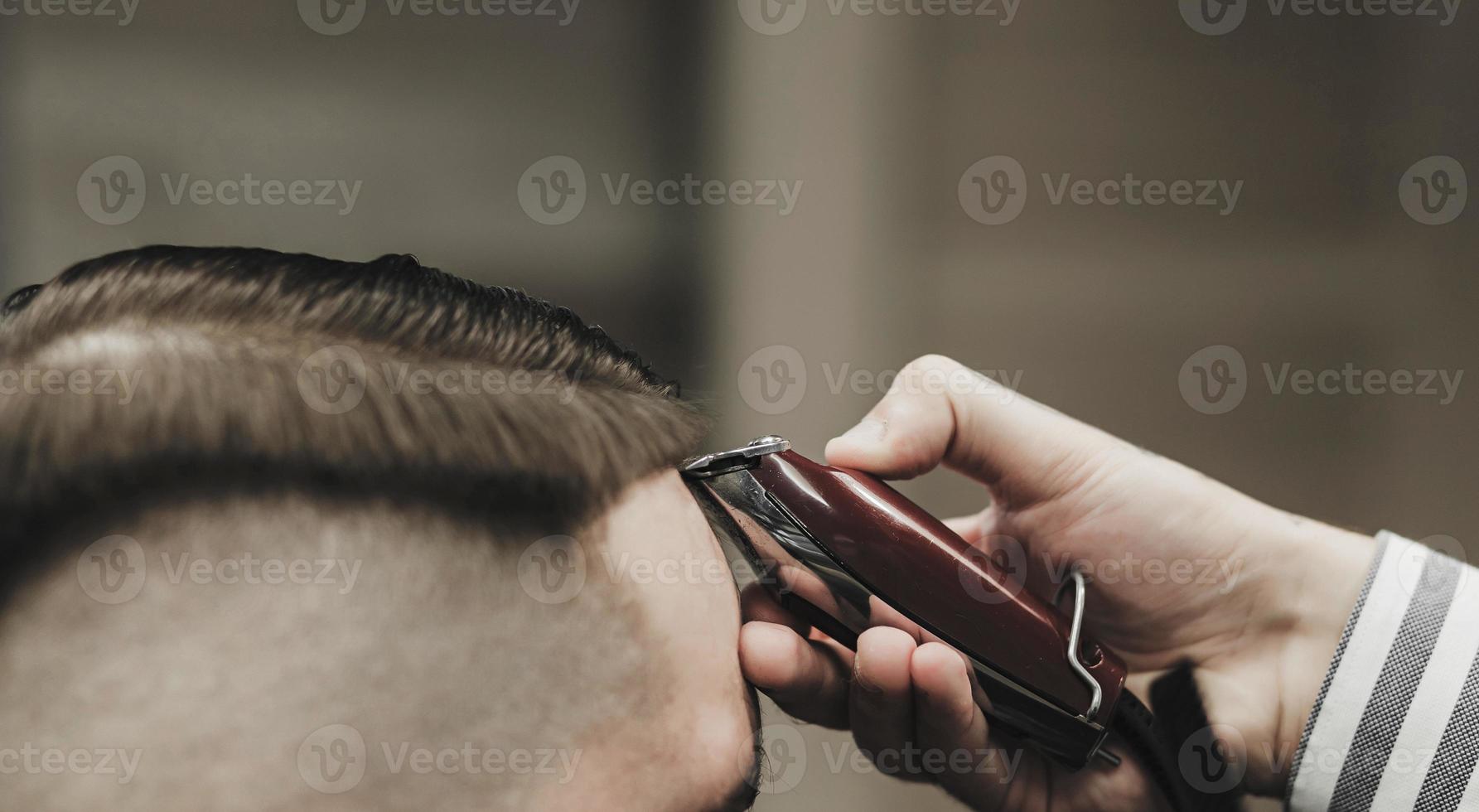 trimming of hair in barber shop photo