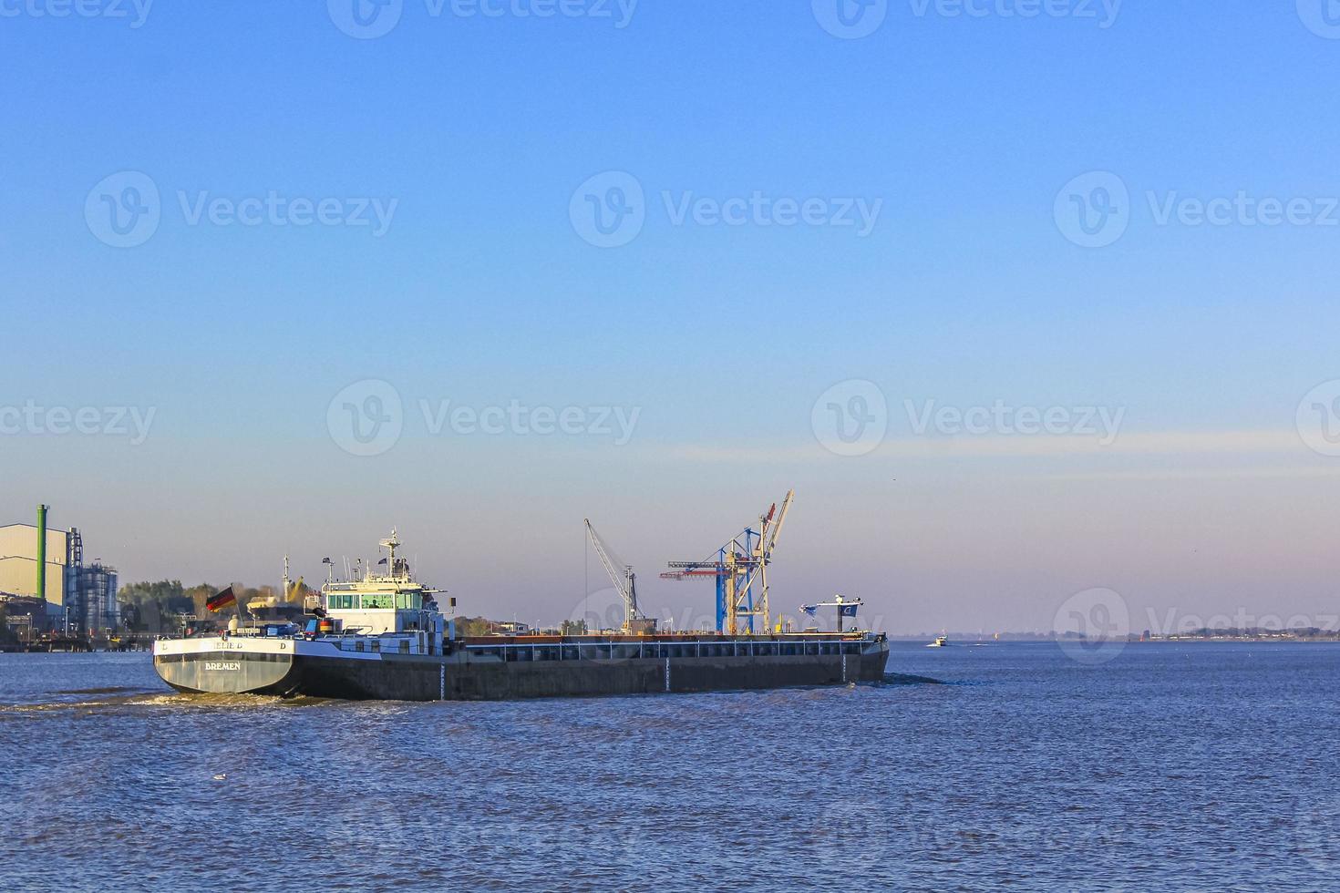 Boats ships in tidelands coast beach landscape Harrier Sand Germany. photo