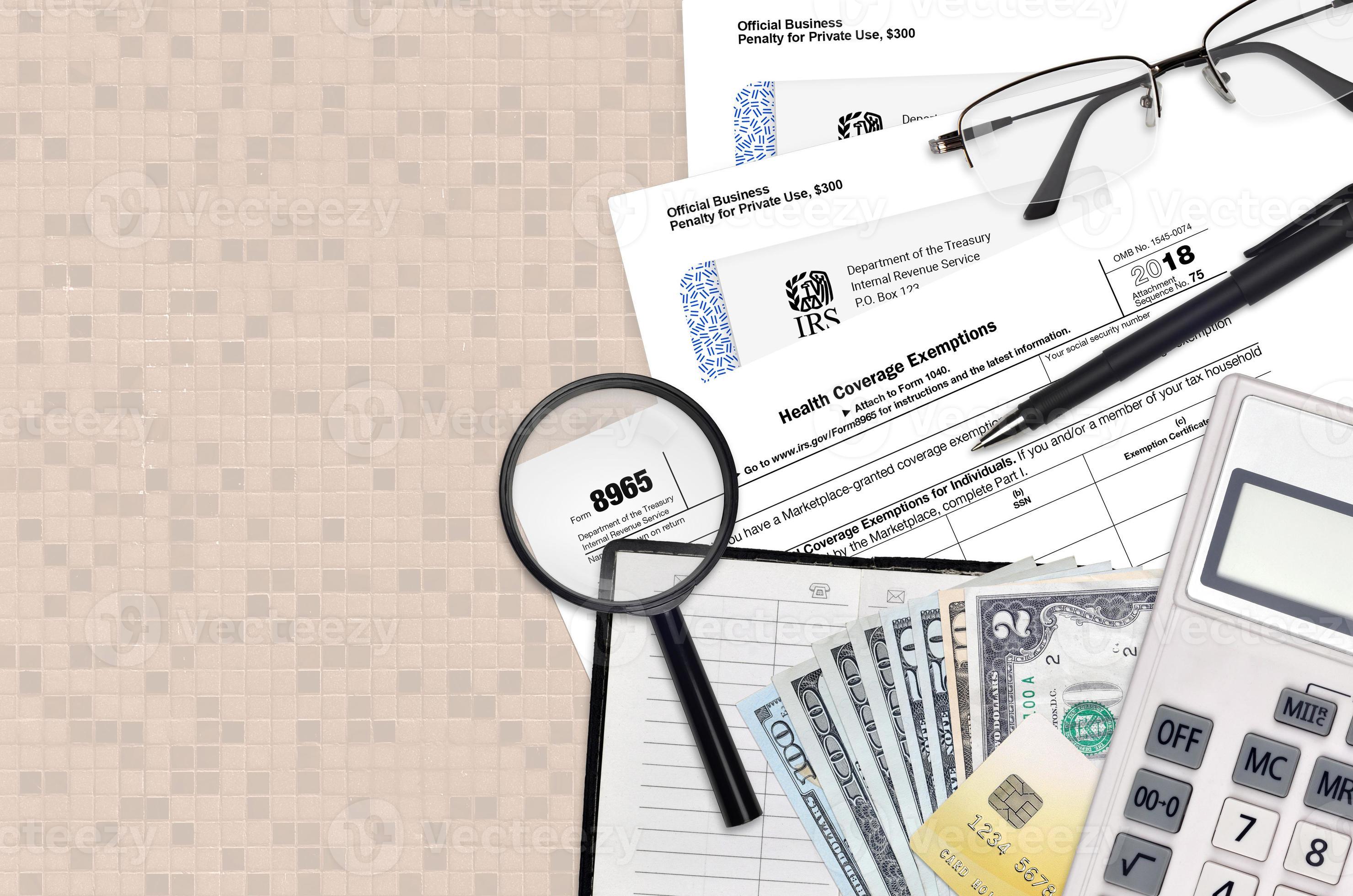 IRS form 8965 Health Coverage Exemptions lies on flat lay office