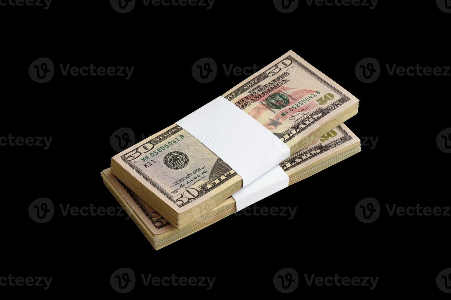 Bundle of US dollar bills isolated on black. Pack of american money with high resolution on perfect black background photo