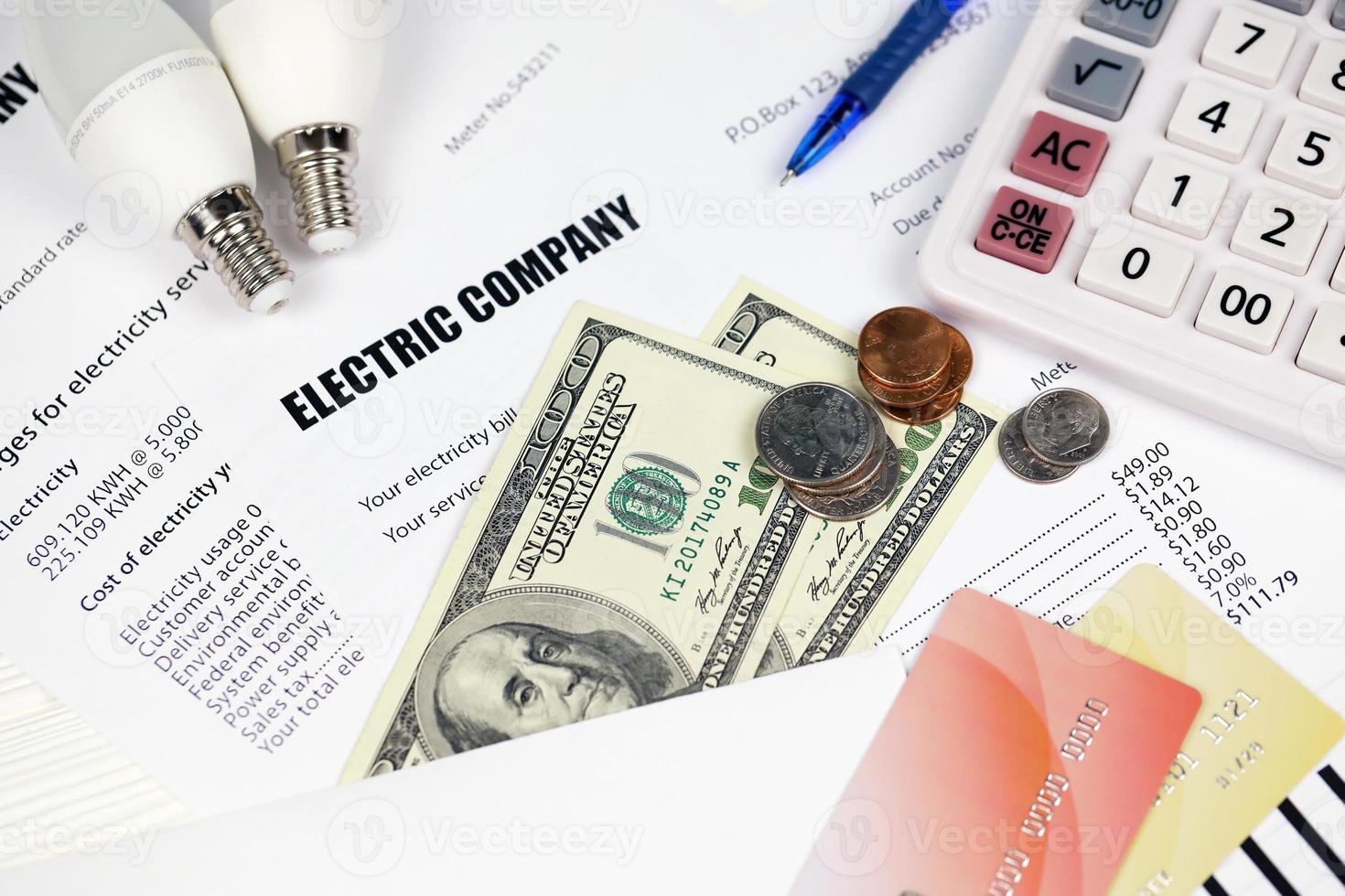 Abstract American electricity bill. Concept of saving money by using energy savings led light bulbs and electric bill payment photo