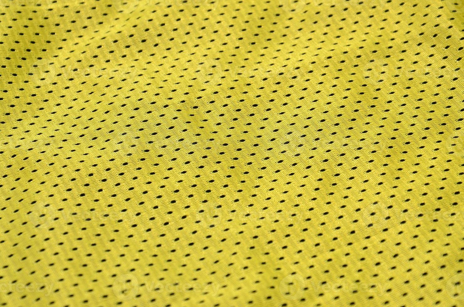 Texture of sportswear made of polyester fiber. Outerwear for sports training has a mesh texture of stretchable nylon fabric photo