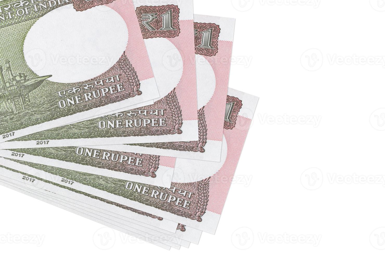 1 Indian rupee bills lies in small bunch or pack isolated on white. Mockup with copy space. Business and currency exchange photo