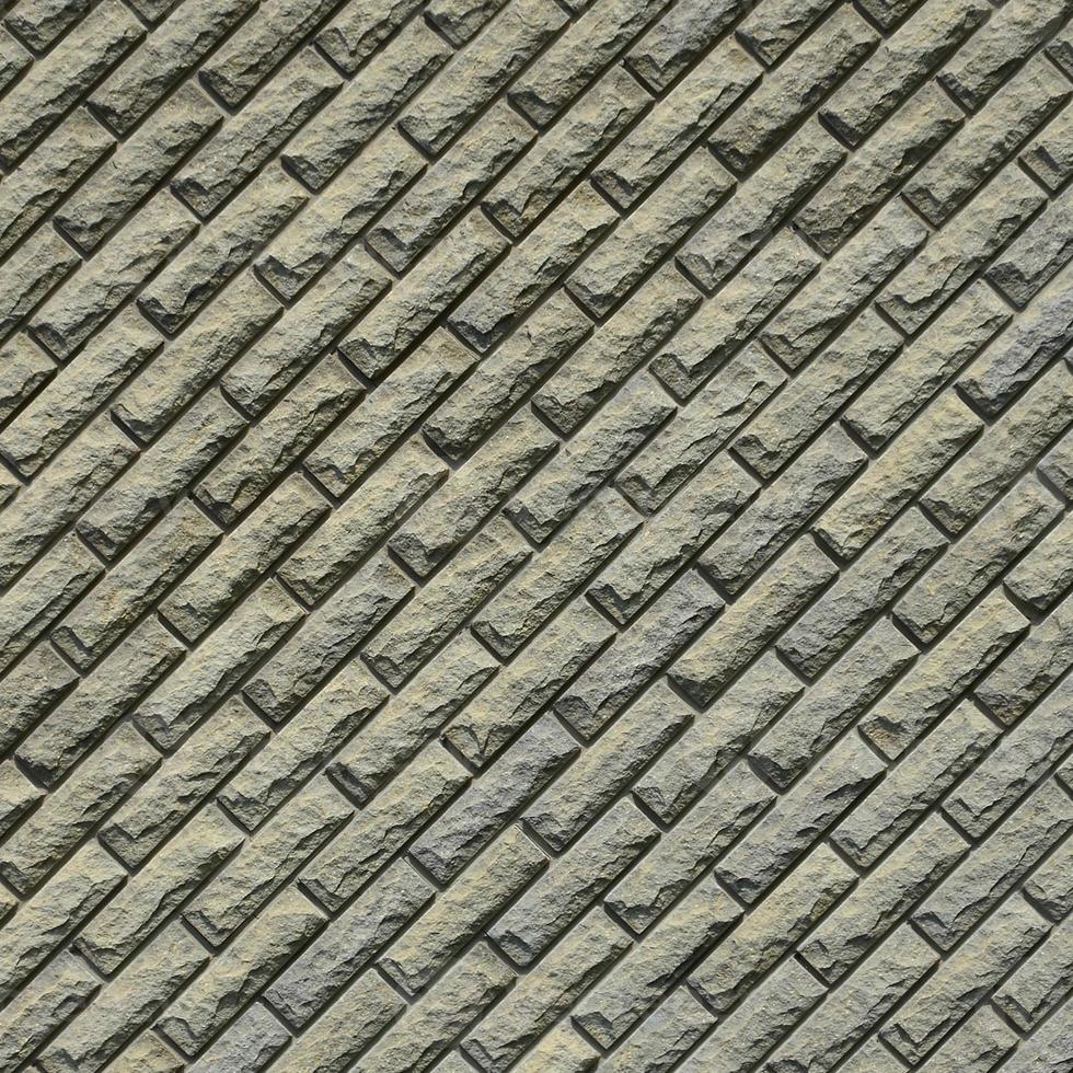 The texture of the wall is made of modern relief brown brick. Background image photo