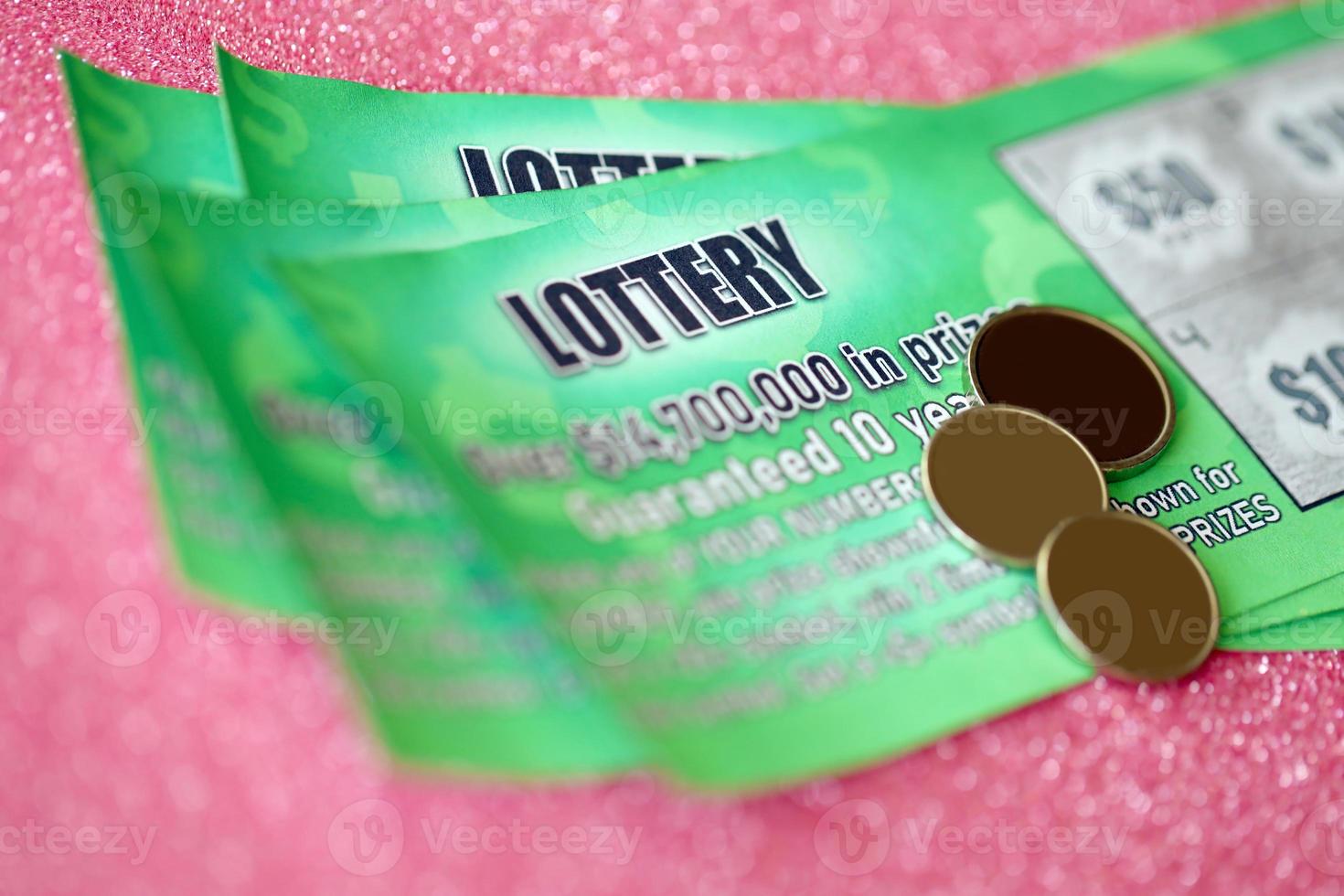 Close up view of green lottery scratch cards. Many used fake instant lottery tickets with gambling results. Gambling addiction photo