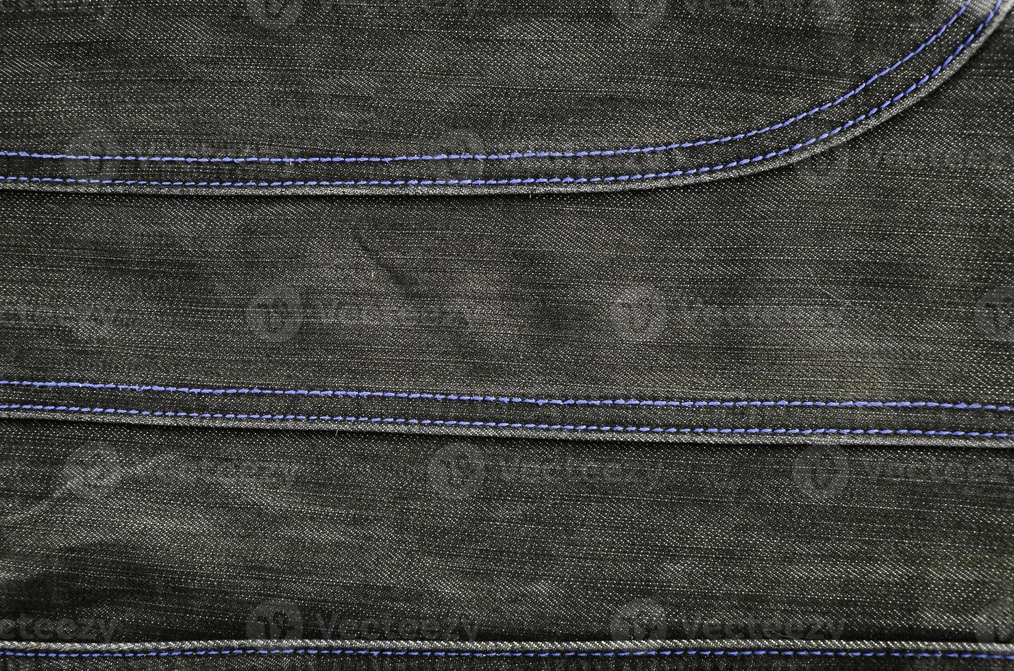 The texture of black denim cloth photo