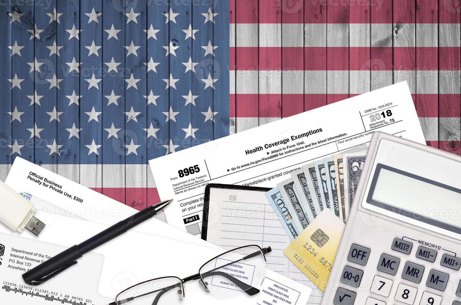 IRS form 8965 Health Coverage Exemptions lies on flat lay office 